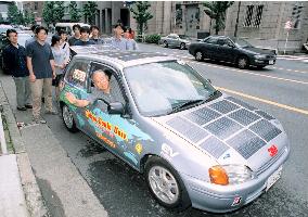 Group departs on around-the-world trip in electric car